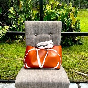 Valentino bag new it is more like an original. I do have the paper work